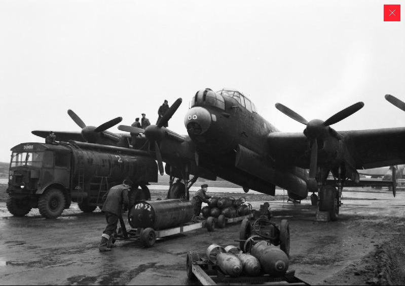 'Bombing up' a Lancaster © IWM (CH14680)
